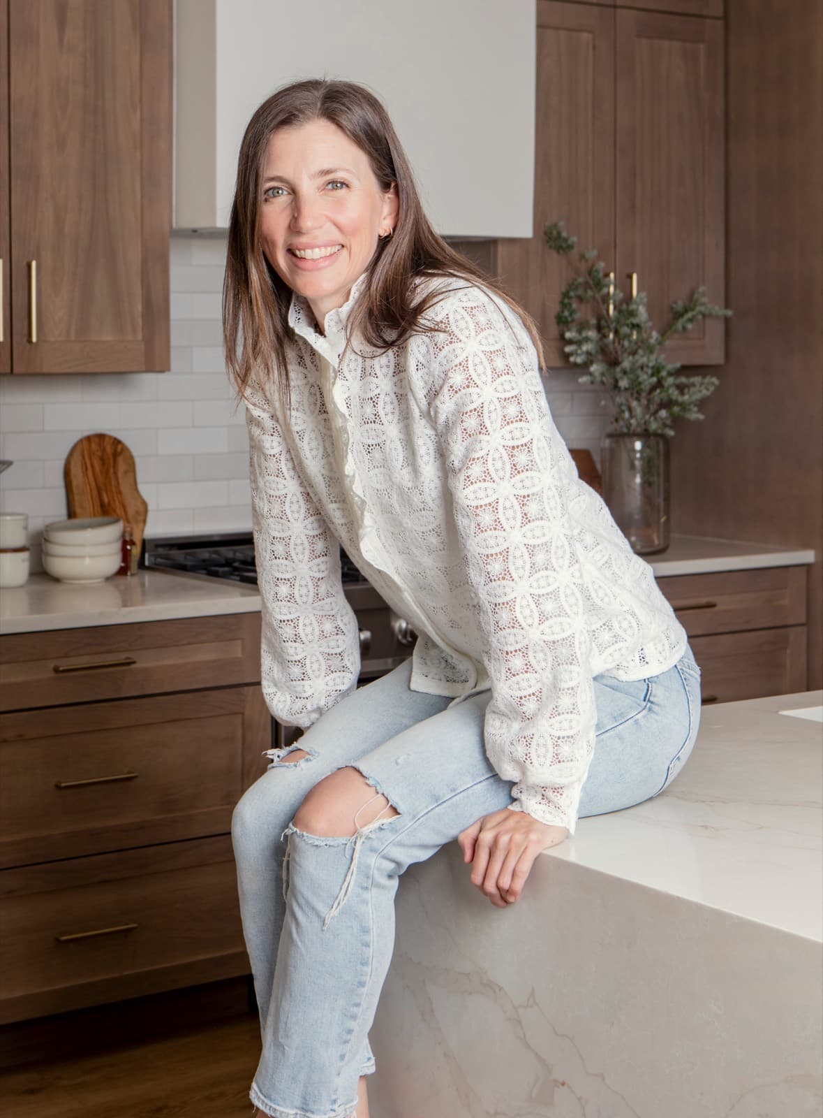 Chef Lauren Lobley seated at her kitchen island
